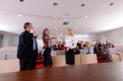 Employees High Fiving when getting awards